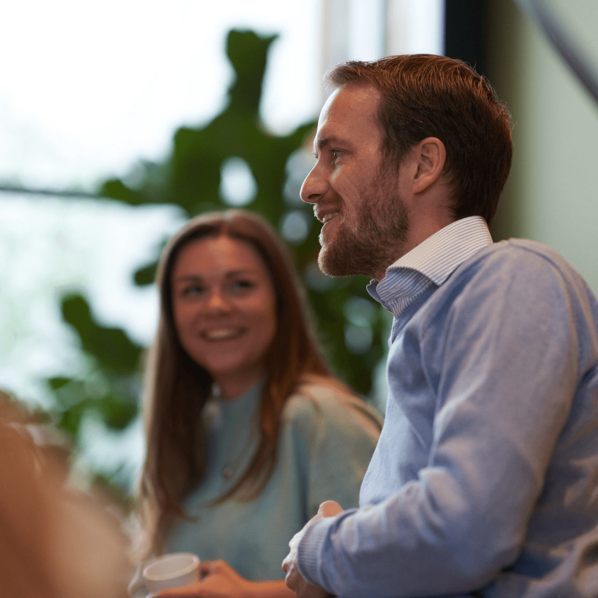 Man and woman at office talking in a meeting