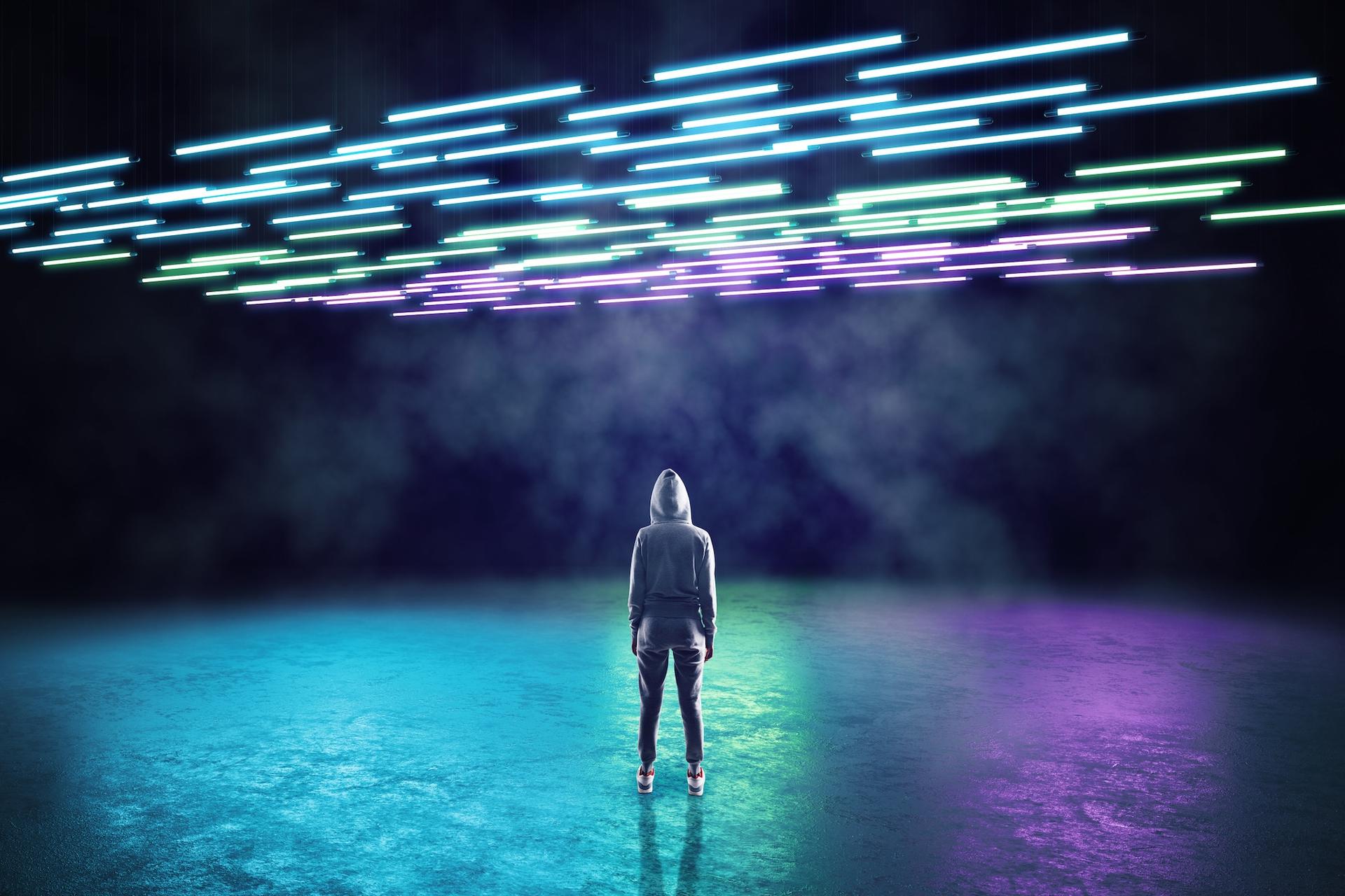 Futuristic image of person standing in neon light