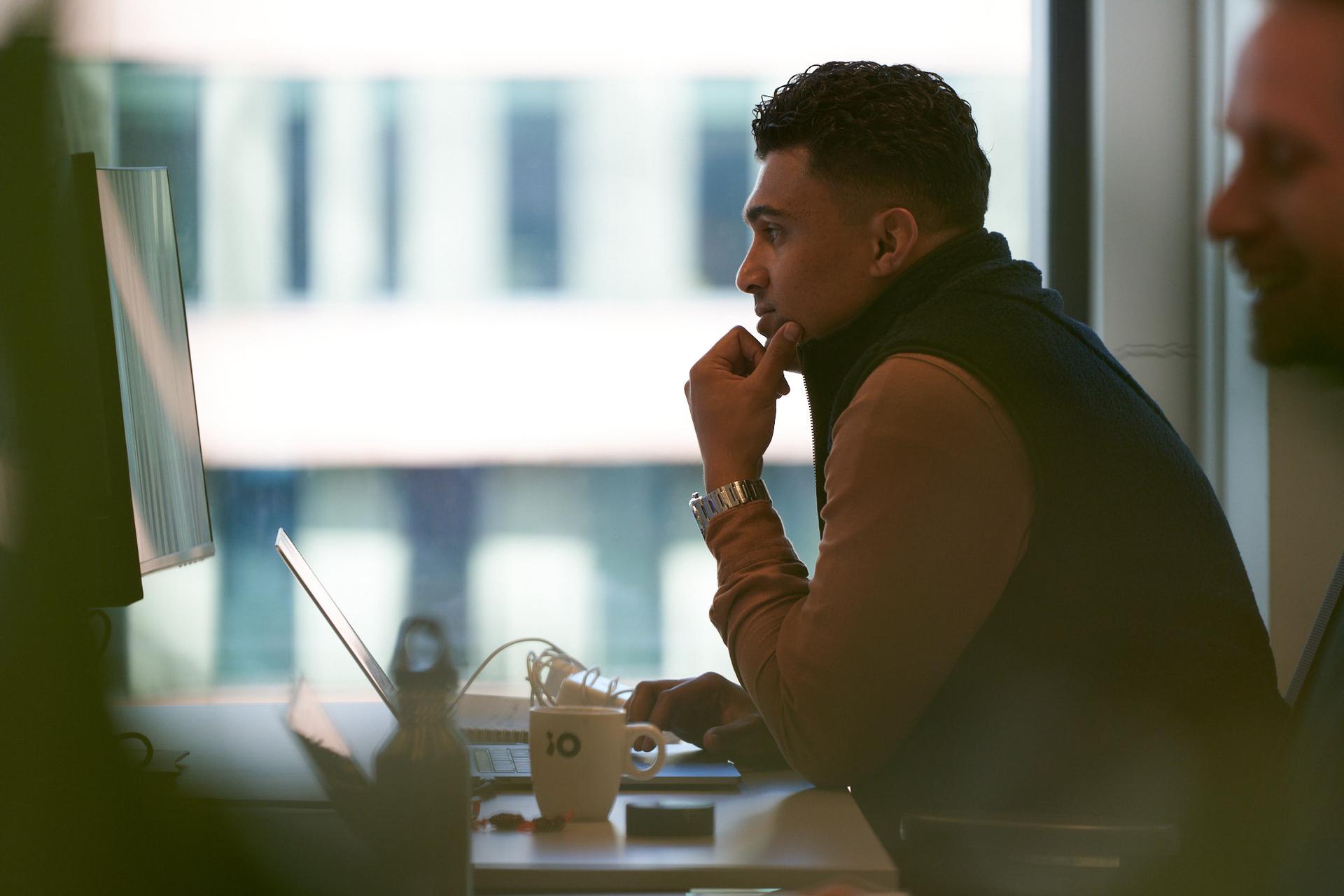 man working with iO cup