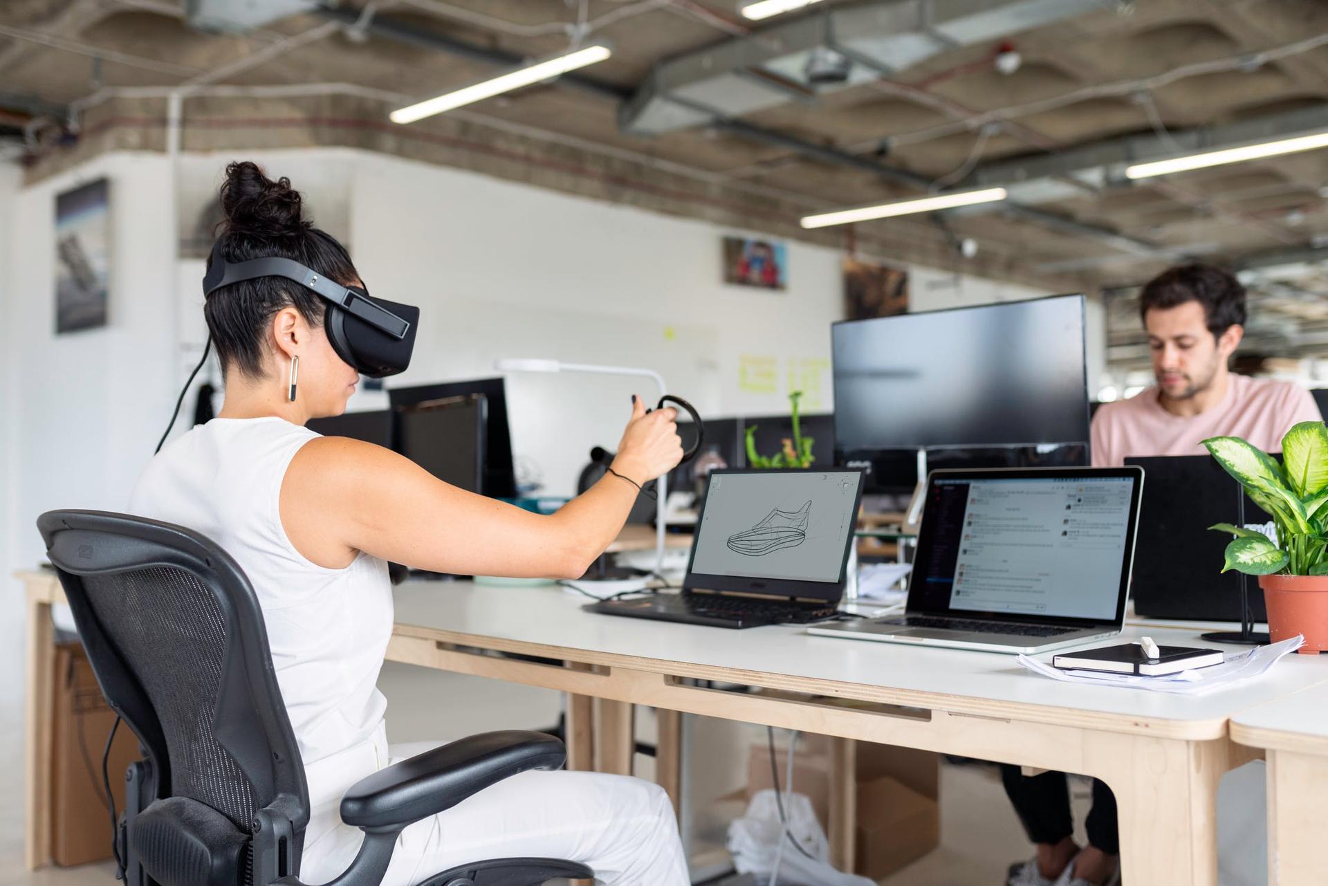 Woman working with VR goggles