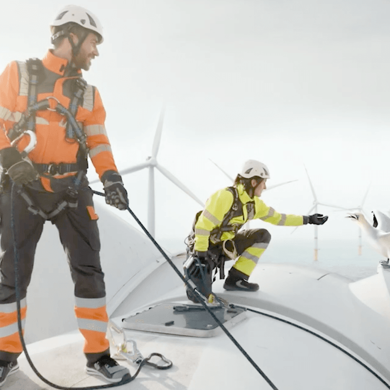 people on top of windturbine